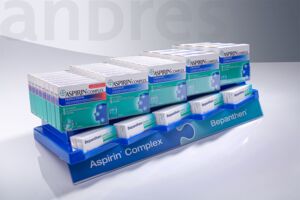 Shelf display/HV display for aspirin made from a material mix of back-printed acrylic glass and partly deep-drawn PET-G as a product holder.